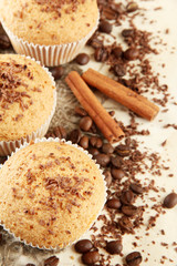 tasty muffin cakes with chocolate, spices and coffee seeds,