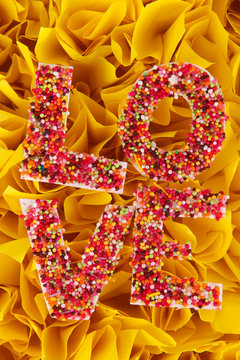 Word Love on decorative yellow background