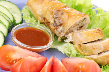 Tasty meat cutlet with garnish on plate close-up