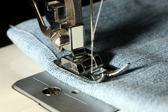 Sewing machine with jeans closeup