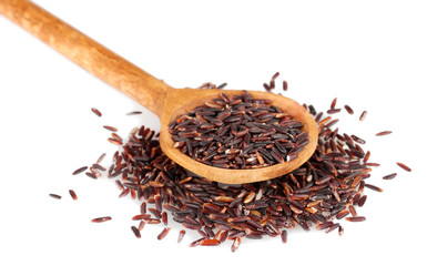 black rice  in wooden  spoon isolated on white background