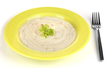 Mashed potatoes in green plate isolated on white