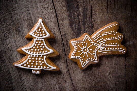 Traditional gingerbread cookies over wooden background