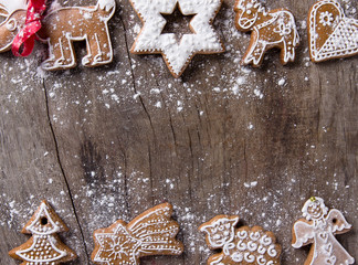 Traditional gingerbread cookies over wooden background