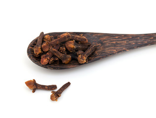 cloves on a wooden spoon