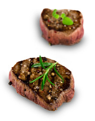 Grilled bbq steaks on white background