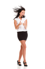 Fototapeta premium Portrait of a pretty young woman giving you thumbs up