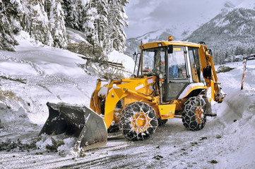 clearing roads of snow and fallen tree