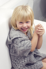 Girl 3 years old in a gray knit sweater