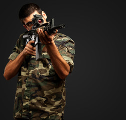 Fototapeta premium Soldier Gunman Aiming His Target
