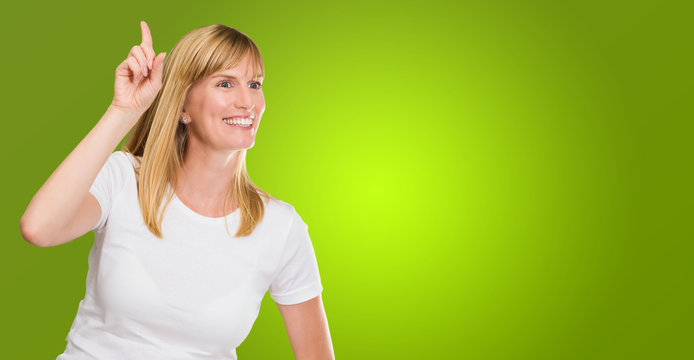 Women Pointing Up With Hand On Hip