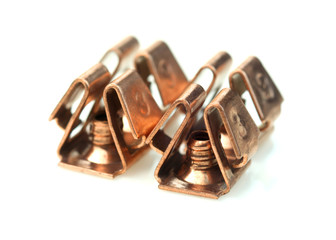 Four threaded inserts on white background