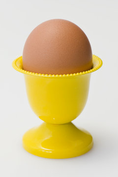 Yellow cup with egg