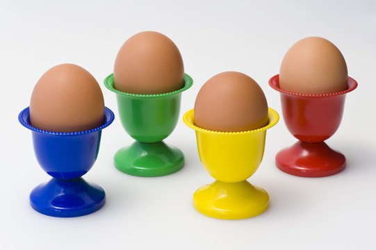 Four colourful egg holders