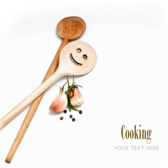 Wooden spoon with garlic and spice