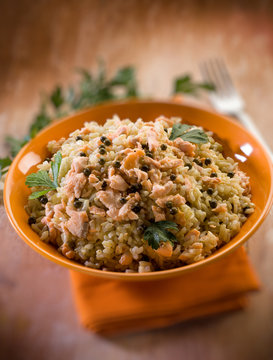 risotto with fresh salmon and green pepper, selective focus