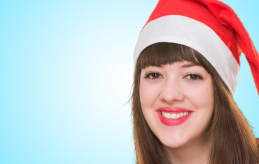 portrait of a happy woman wearing a christmas hat
