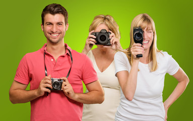 Happy Family Holding Camera