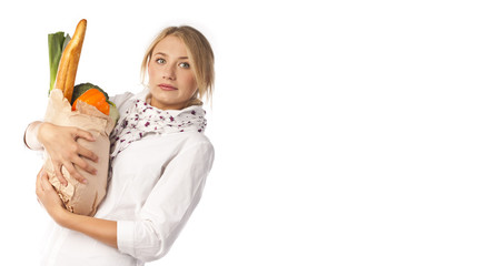Attractive woman holding a bag of useful food