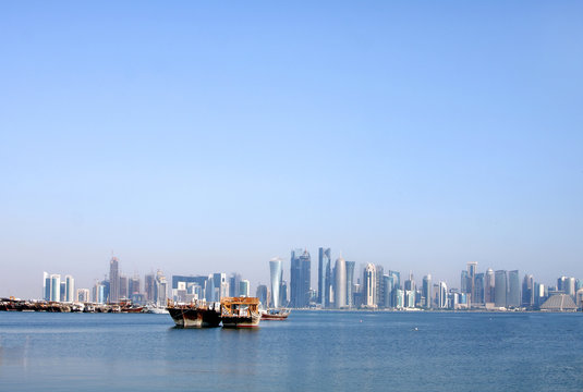 Traditional dhow of Qatar on beautiful doha skyline
