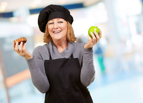 Portrait Of A Woman Holding Fruit