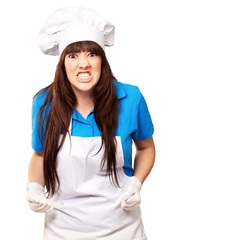 portrait of a female chef clenching