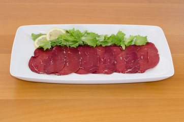 Bresaola with  lemon and green salad