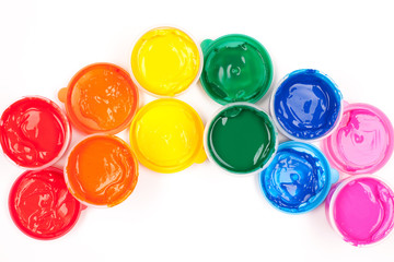 motley paints on the white background. paints arranged as rainbo
