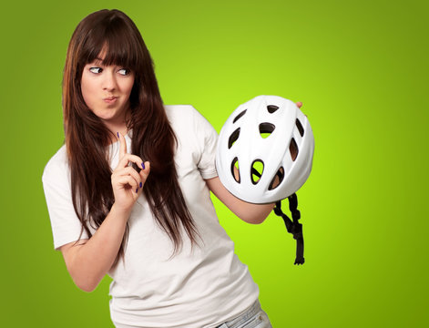 Portrait Of A Young Female Holding A Helmet