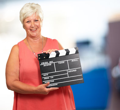 Senior Woman Holding Clapper