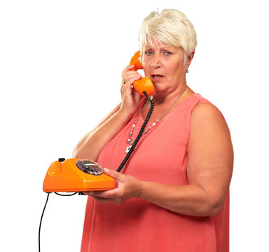 Portrait Of A Senior Woman Holding A Retro Phone
