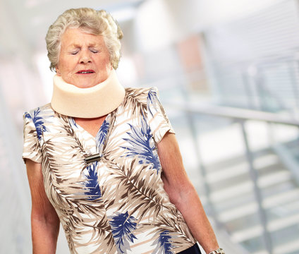 A Senior Woman Wearing A Neckbrace