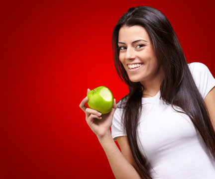 Portrait Of A Female Eating An Apple