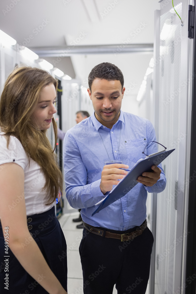 Poster Technicians talking in data center