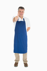 Man in apron giving thumbs up