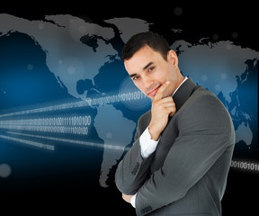Businessman standing in front of world map