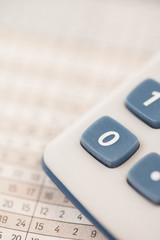 Close-up of statistics and calculator