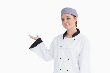 Happy chef showing something