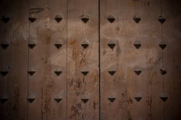 Old wooden background with metal knobs