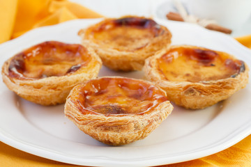Pasteis de nata on the white plate