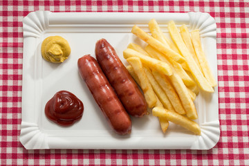 Sausages, french fries and condiments