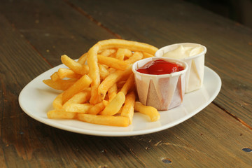 French fries with condiment
