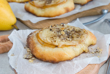 Portion sweet pizza with pears, cheese, honey and nuts