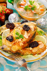breaded carp with almonds and prune for christmas