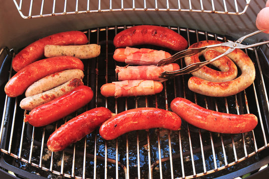 Sausages are grilled at the barbecue party