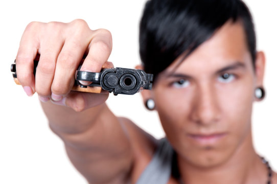Hispanic man Pointing Gun at Camera