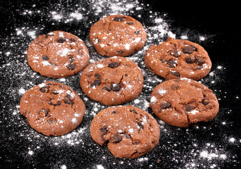 Chocolate chips cookies isolated on black