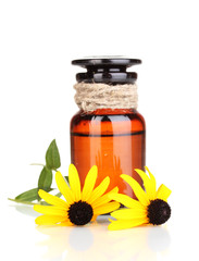 medicine bottle and flowers isolated on white