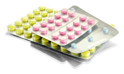 pills packed in blisters, isolated on white