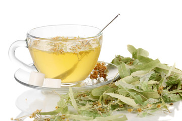 Glass cup of tea with linden isolated on white